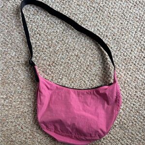 Bright pink Baggu medium sized crescent bag